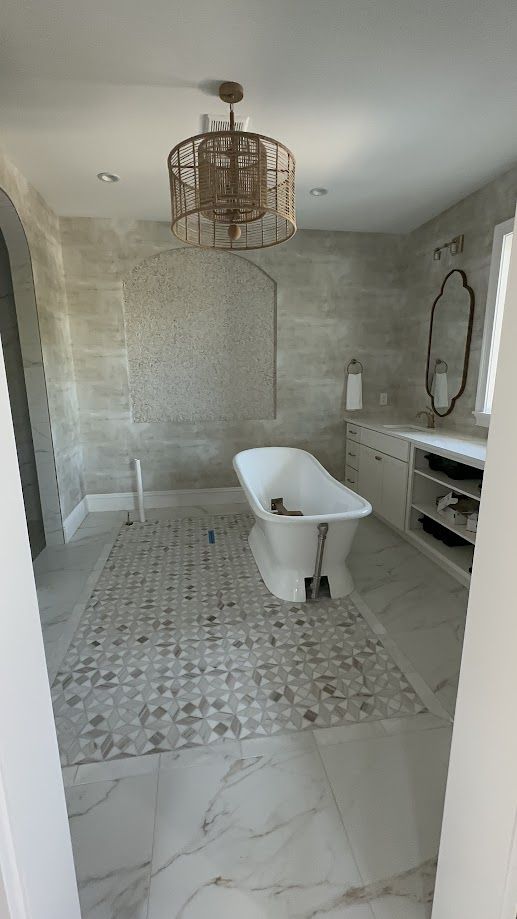 Primary bathroom with freestanding tub, cleaned to a shine